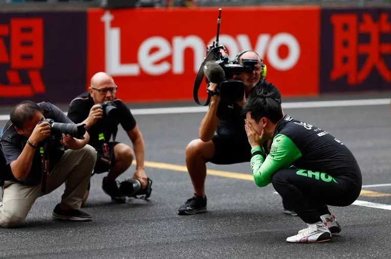 Zhou Guanyu, Stake F1 Team Kick Sauber, gets emotional on the grid after the race
