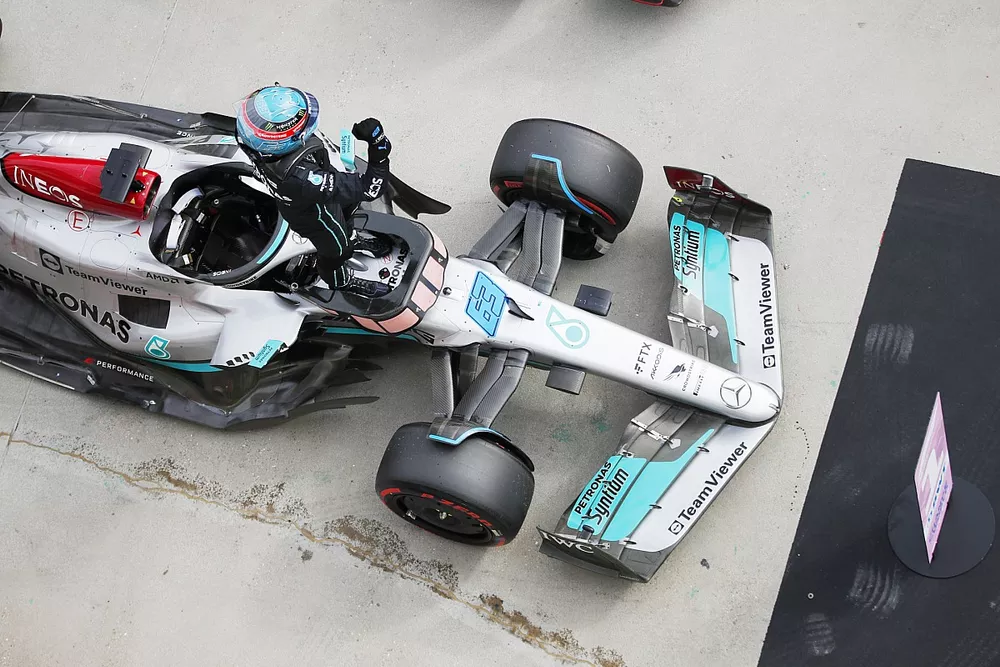 George Russell, Mercedes-AMG, celebrates on arrival in Parc Ferme after securing pole position
