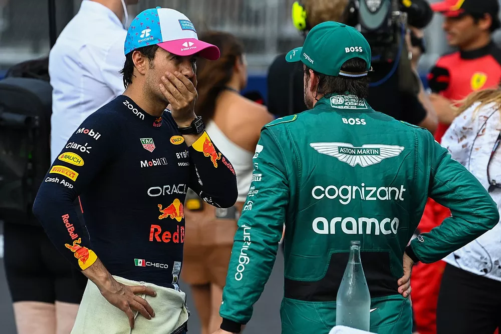 Pole man Sergio Perez, Red Bull Racing, talks with Fernando Alonso, Aston Martin F1 Team, in Parc Ferme after Qualifying