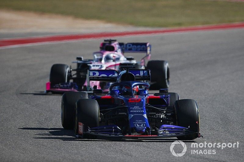 Daniil Kvyat, Toro Rosso STR14, leads Sergio Perez, Racing Point RP19