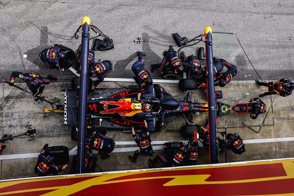 Sergio Perez, Red Bull Racing RB16B, makes a pit stop