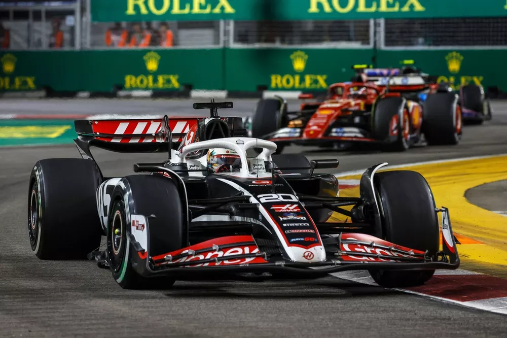 Kevin Magnussen, Haas VF-24, leads Carlos Sainz, Ferrari SF-24