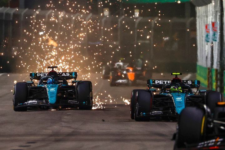 Sparks fly from George Russell, Mercedes F1 W15