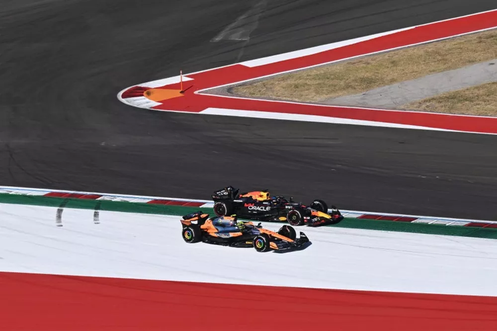 Lando Norris, McLaren MCL38, battles with Max Verstappen, Red Bull Racing RB20 