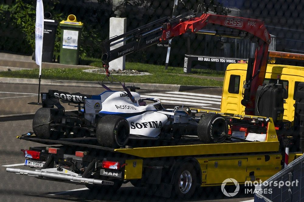 The car of George Russell, Williams FW43, is returned to the garage on a truck