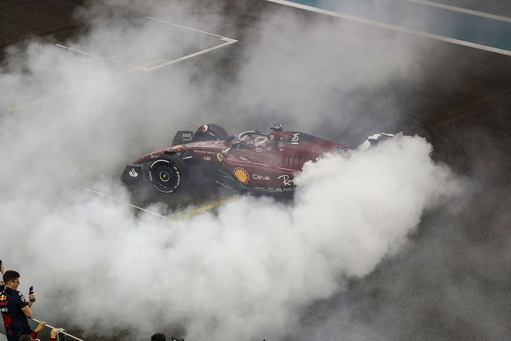 Charles Leclerc, Ferrari F1-75, 2nd position, performs donuts on the grid at the end of the race