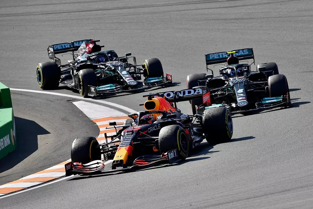 Max Verstappen, Red Bull Racing RB16B, Valtteri Bottas, Mercedes W12, and Lewis Hamilton, Mercedes W12