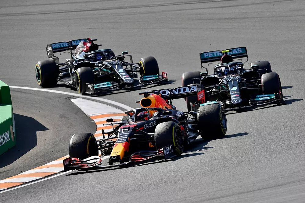 Max Verstappen, Red Bull Racing RB16B, Valtteri Bottas, Mercedes W12, and Lewis Hamilton, Mercedes W12