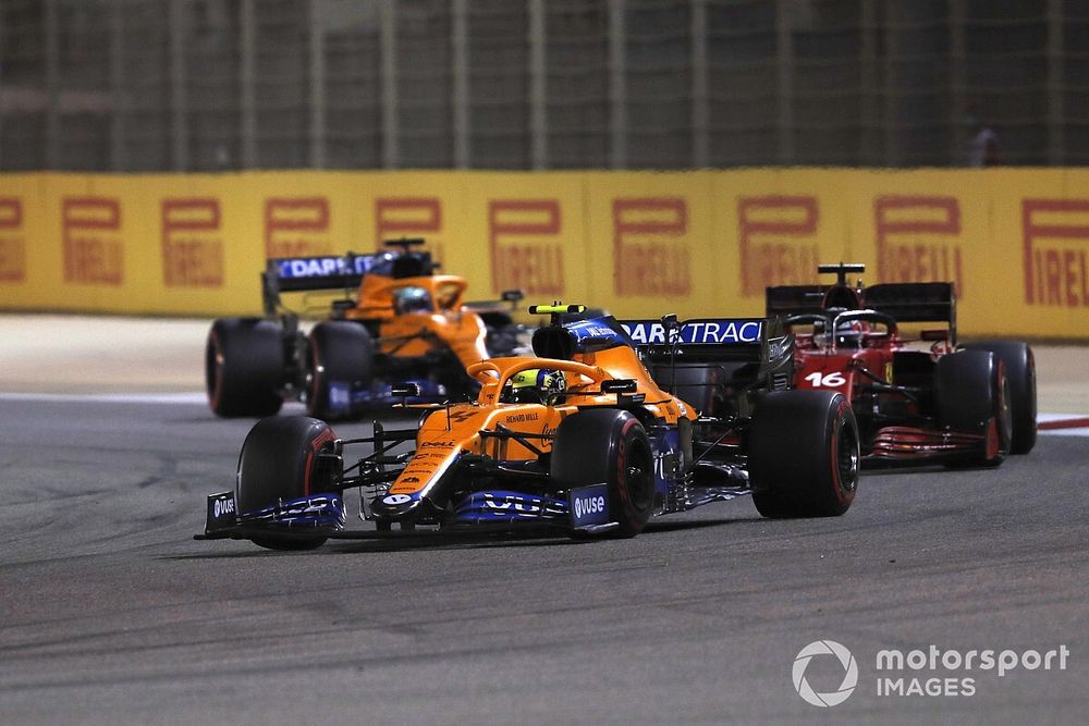 Lando Norris, McLaren MCL35M, Charles Leclerc, Ferrari SF21, and Daniel Ricciardo, McLaren MCL35M