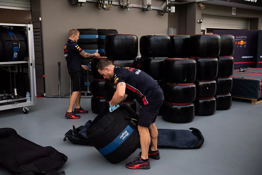 Pirelli tyres allocated to Red Bull are sorted into blankets in the paddock