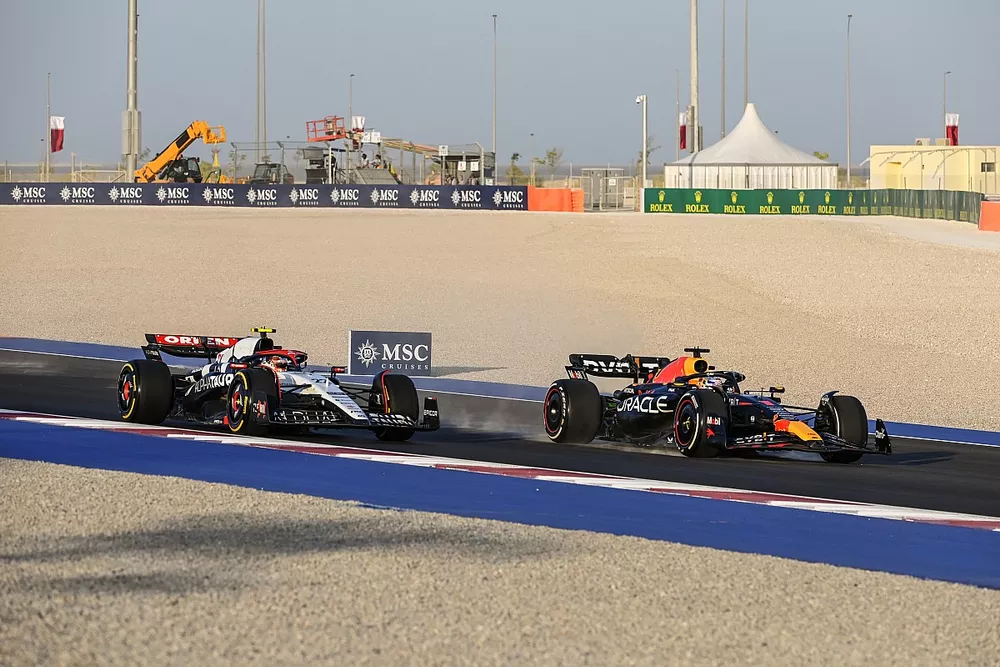 Max Verstappen, Red Bull Racing RB19, leads Yuki Tsunoda, AlphaTauri AT04