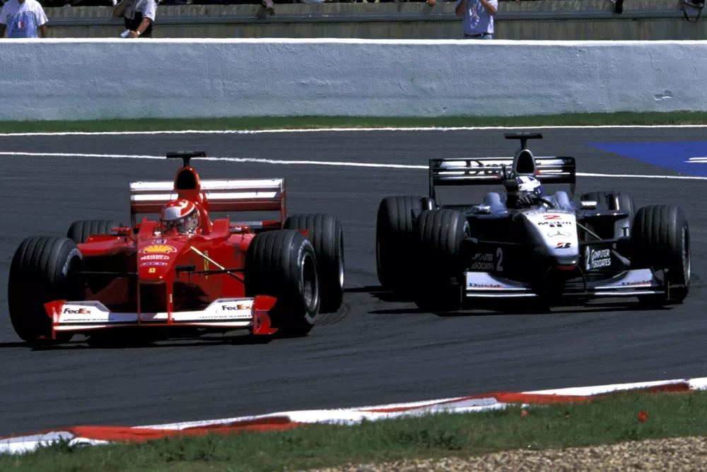 Race winner David Coulthard (GBR) McLaren MP4-15 makes his feelings known to Michael Schumacher (GER), Ferrari F2000, and gives him "the finger."
French Grand Prix, Magny-Cours, France, 2 July 2000.