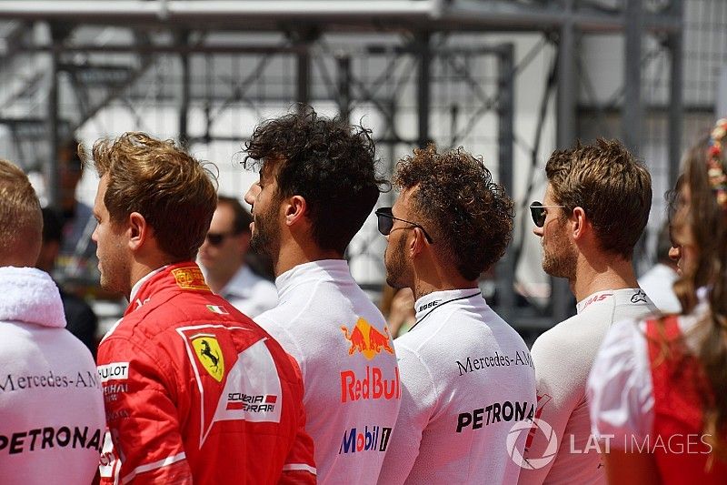 Drivers observe the National Anthem