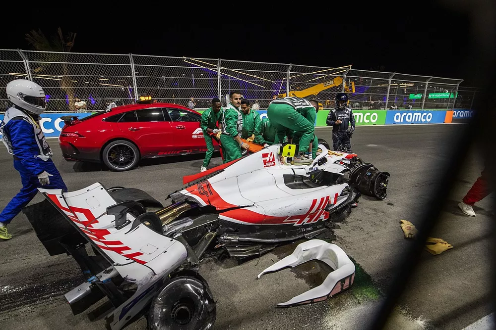 Medics and marshals attend the scene after a heavy crash for Mick Schumacher, Haas VF-22, in Q2