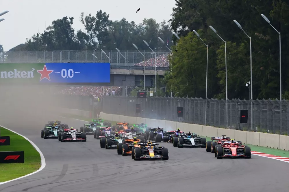 Race start, as Max Verstappen, Red Bull Racing RB20, battles with Carlos Sainz, Ferrari SF-24, for the lead