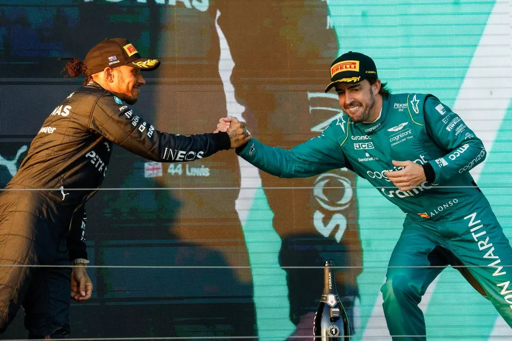 Lewis Hamilton, Mercedes-AMG, 2nd position, Fernando Alonso, Aston Martin F1 Team, 3rd position, greet each other on the podium