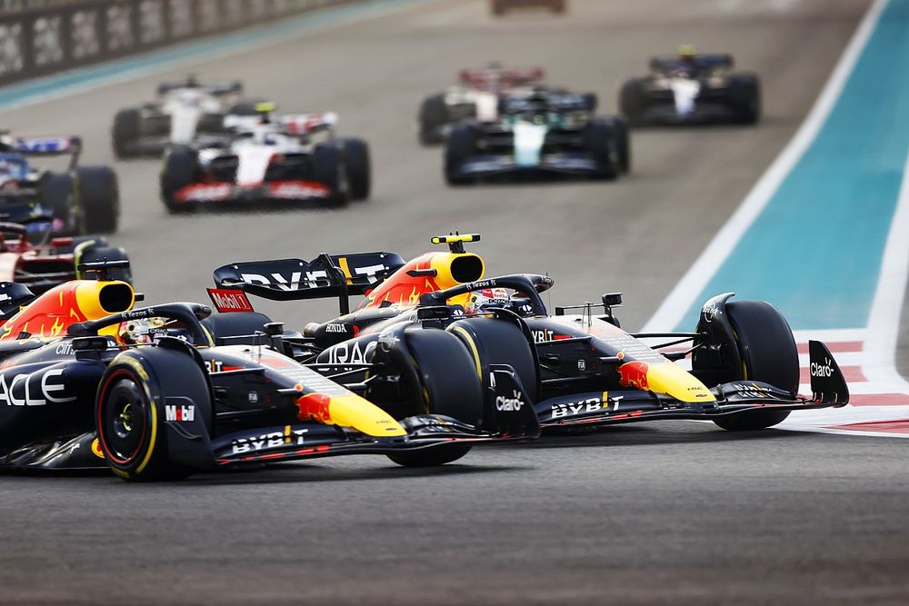 Max Verstappen, Red Bull Racing RB18, battles with Sergio Perez, Red Bull Racing RB18, at the start