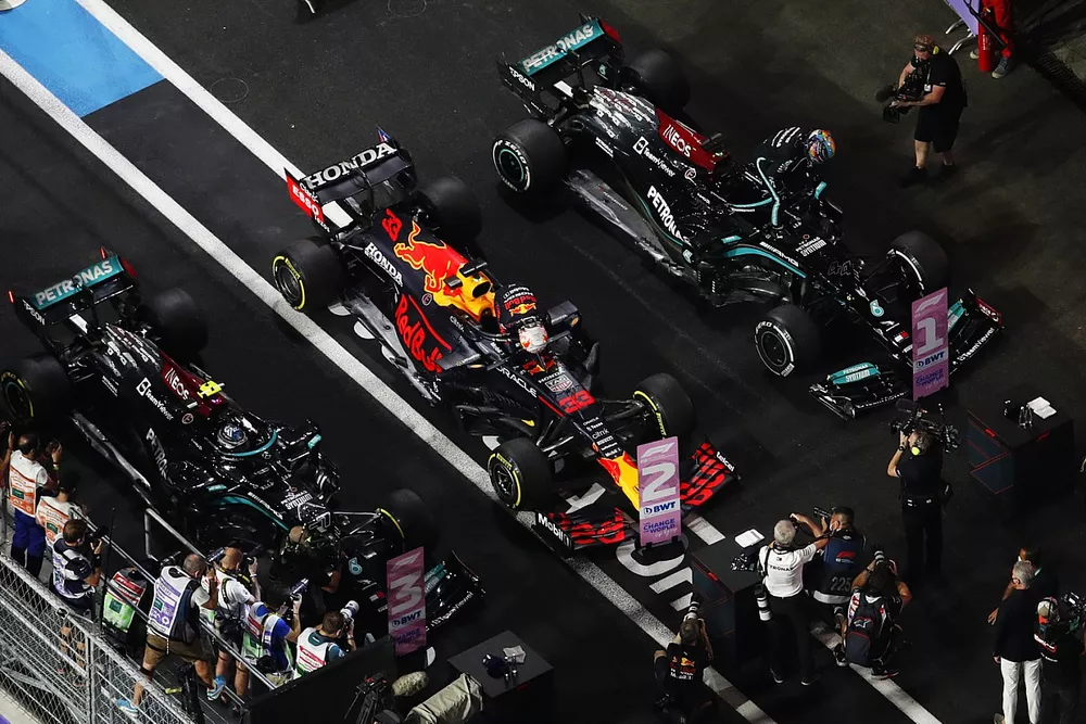 Lewis Hamilton, Mercedes, 1st position, Max Verstappen, Red Bull Racing, 2nd position, and Valtteri Bottas, Mercedes, 3rd position, arrive in Parc Ferme