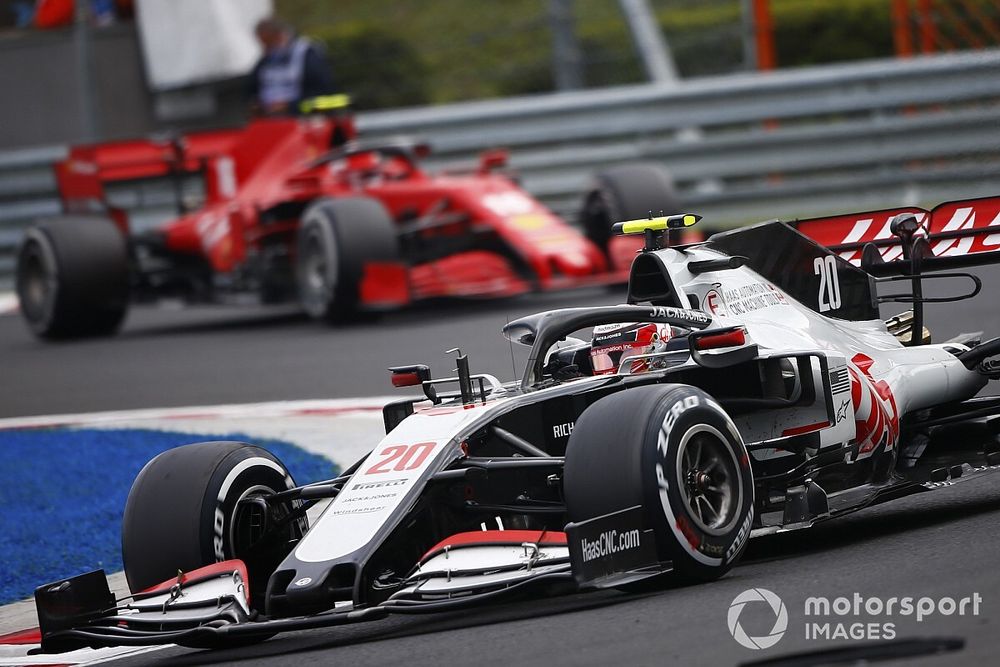 Kevin Magnussen, Haas VF-20, leads Charles Leclerc, Ferrari SF1000