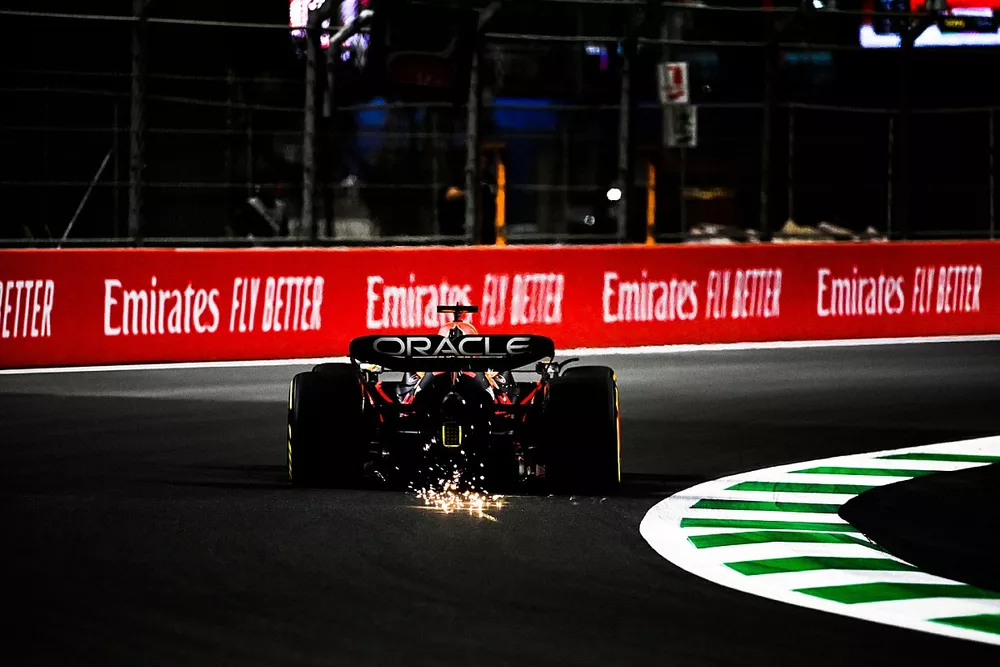 Max Verstappen, Red Bull Racing RB18, kicks up some sparks