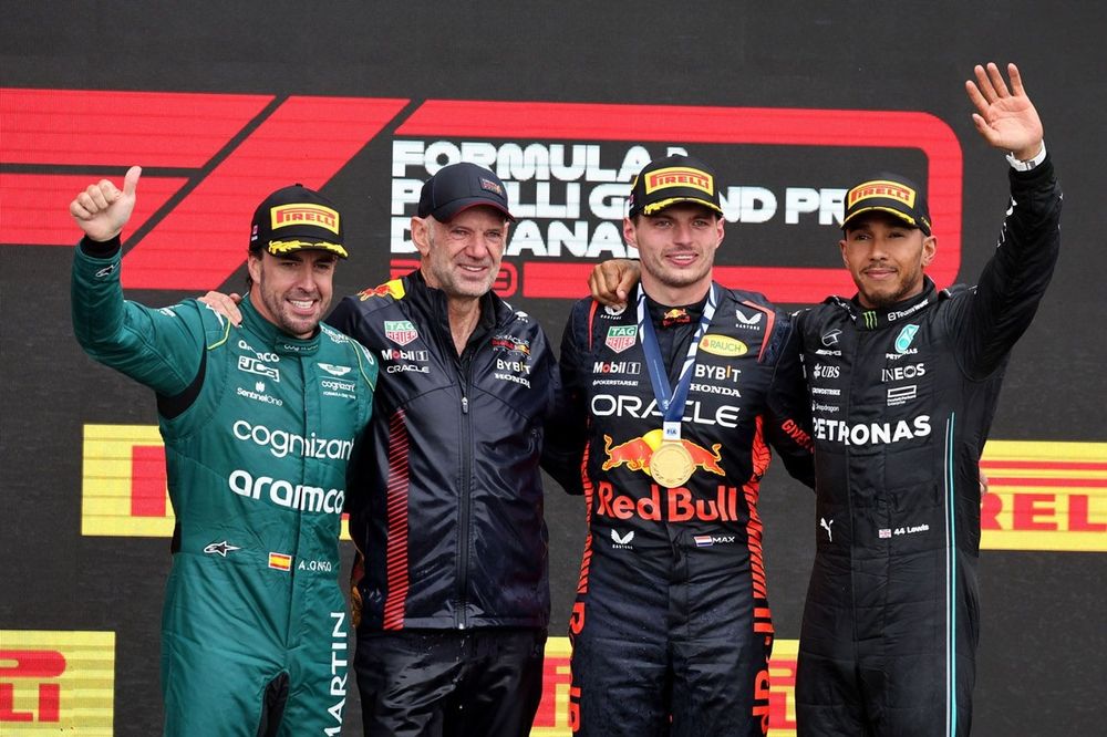 Fernando Alonso, Aston Martin F1 Team, 2nd position, Adrian Newey, Chief Technology Officer, Red Bull Racing, Max Verstappen, Red Bull Racing, 1st position, Lewis Hamilton, Mercedes-AMG, 3rd position, on the podium