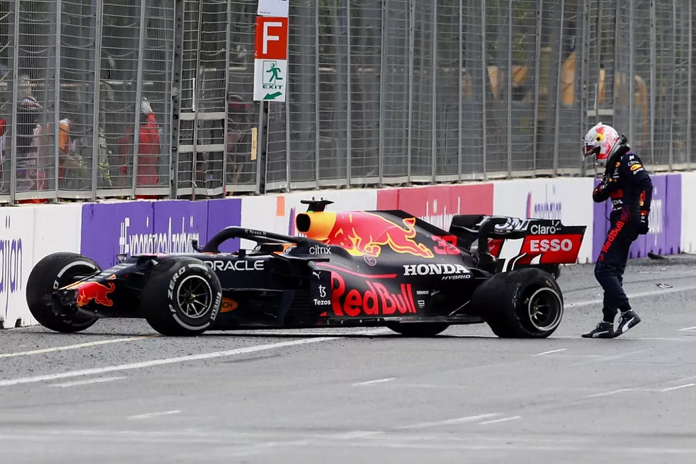 Max Verstappen, Red Bull Racing RB16B, kicks his car after crashing out