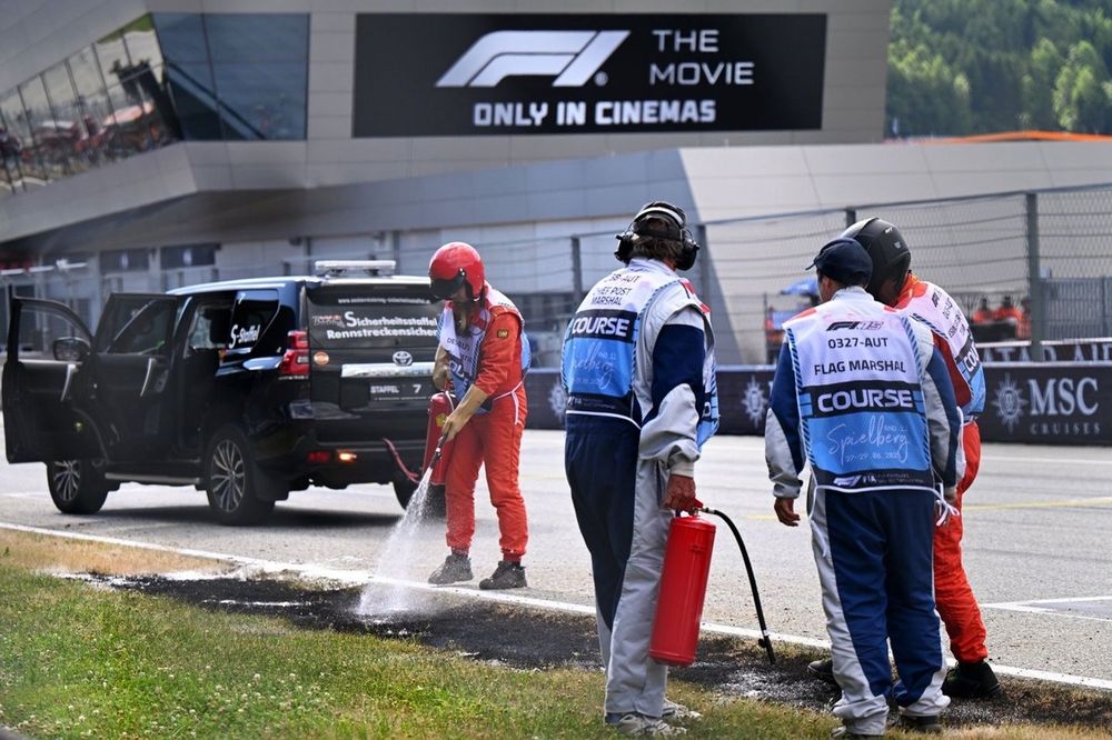  Marshals extinguish a trackside fire in Q2 during qualifying 