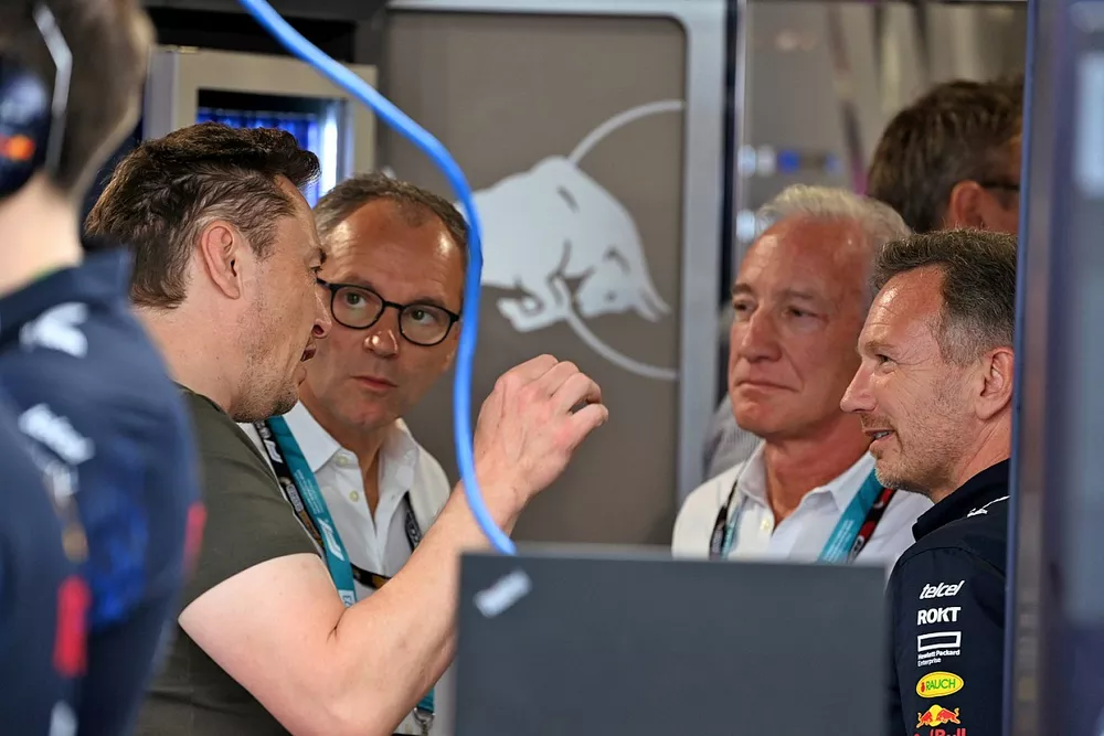Elon Musk, Stefano Domenicali, CEO, Formula 1, Greg Maffei, F1, Christian Horner, Team Principal, Red Bull Racing, talk in the Red Bull Racing garage