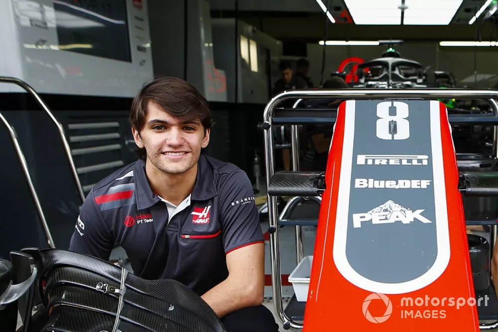Haas test and development drivers Pietro Fittipaldi and Louis Deletraz pose with a front wing and nose cone