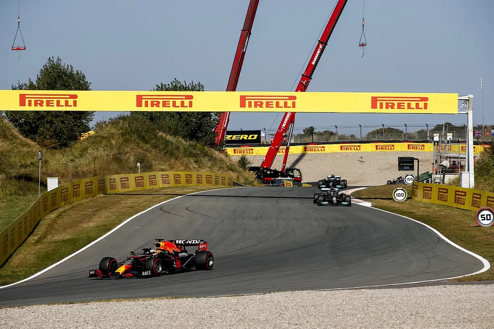 Max Verstappen, Red Bull Racing RB16B, Lewis Hamilton, Mercedes W12, and Valtteri Bottas, Mercedes W12