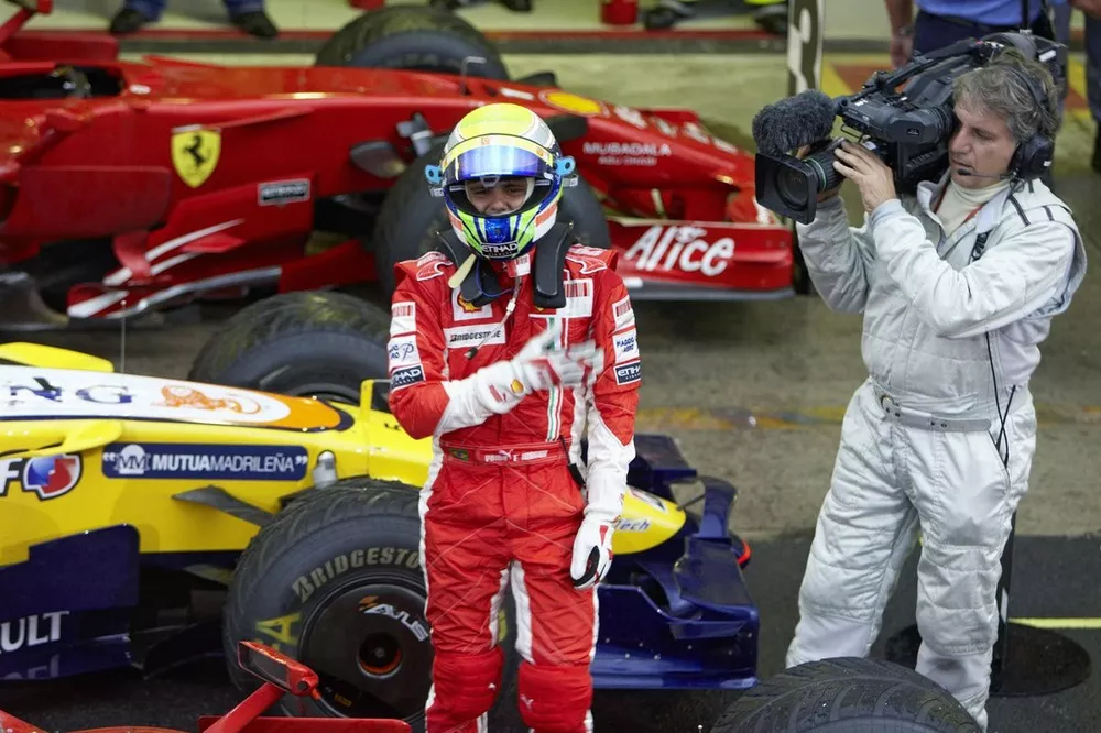 Felipe Massa celebrates a proud victory, despite losing the championship on the last lap