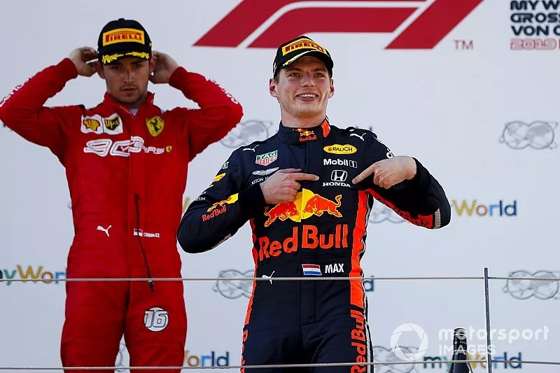 Race winner Max Verstappen, Red Bull Racing celebrates on the podium with Charles Leclerc, Ferrari
