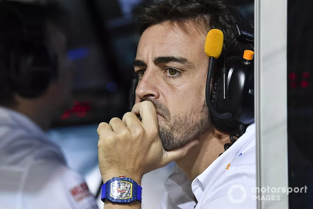 Fernando Alonso on the McLaren pit wall during Qualifying