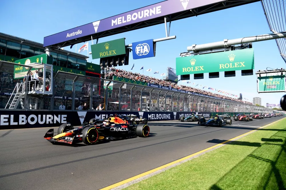 Max Verstappen, Red Bull Racing RB19, leads George Russell, Mercedes F1 W14, Sir Lewis Hamilton, Mercedes F1 W14, and the rest of the field at the start