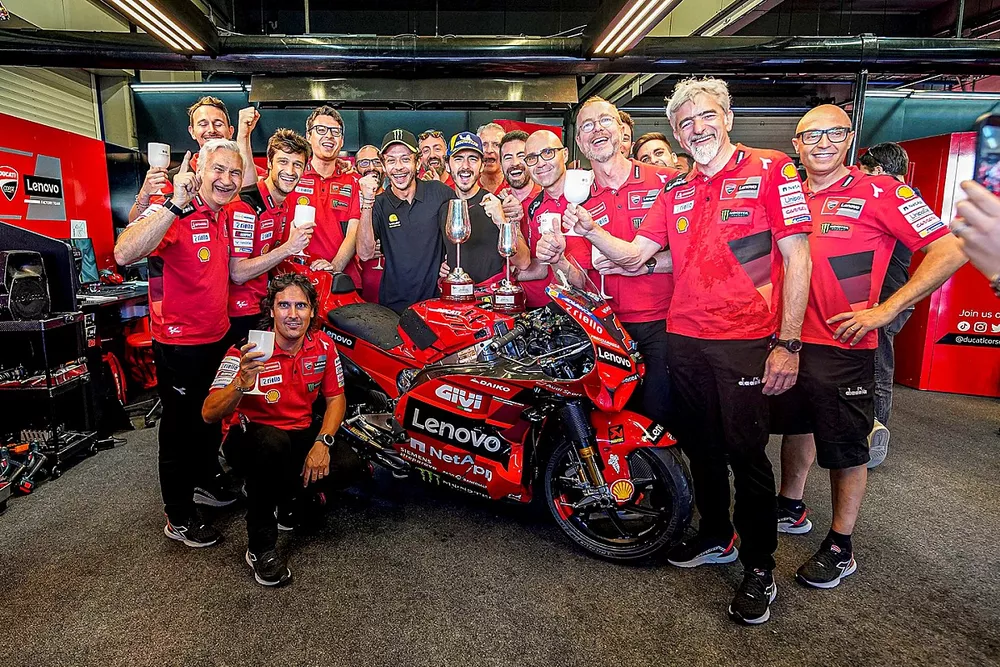 Valentino Rossi celebrates Francesco Bagnaia victory