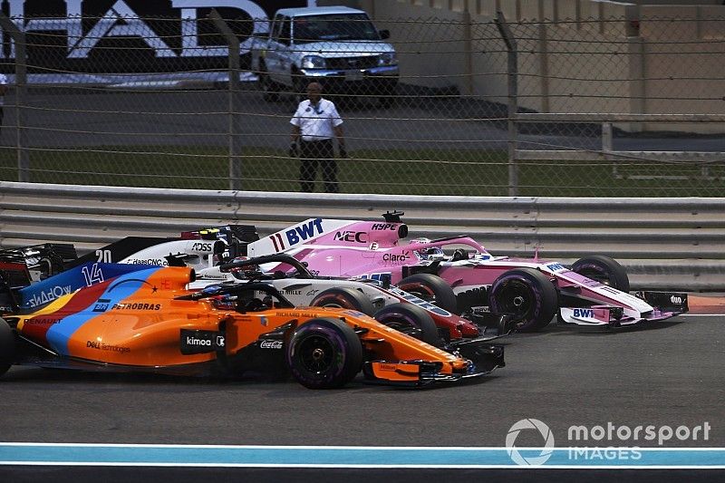 Sergio Perez, Racing Point Force India VJM11, Kevin Magnussen, Haas F1 Team VF-18, and Fernando Alonso, McLaren MCL33
