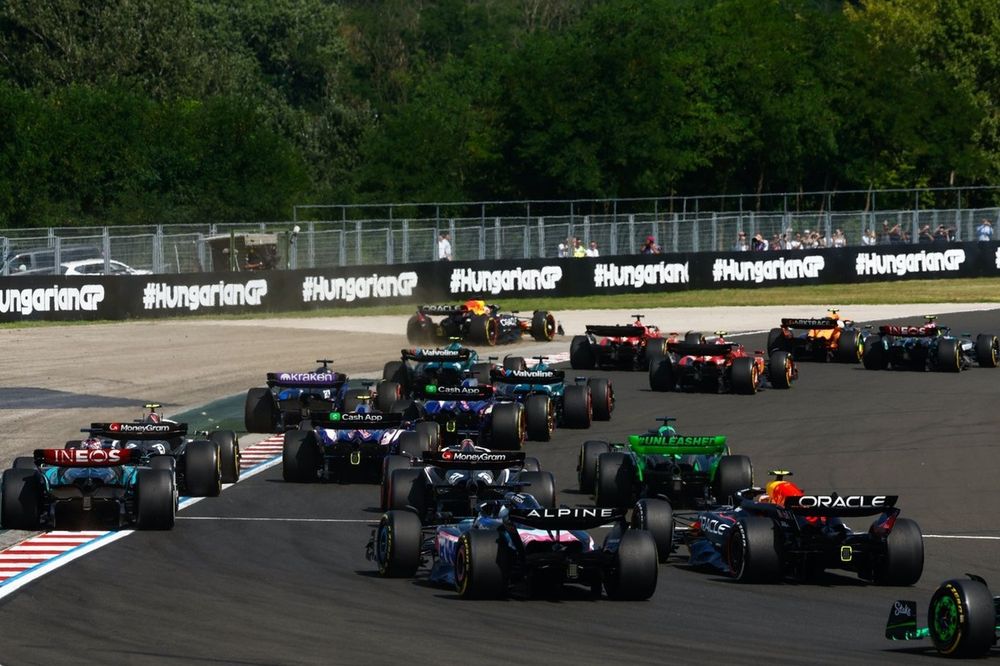 Lando Norris, McLaren MCL38, Lewis Hamilton, Mercedes F1 W15, Charles Leclerc, Ferrari SF-24, Carlos Sainz, Ferrari SF-24, the remainder of the field at the start as Max Verstappen, Red Bull Racing RB20, runs wide