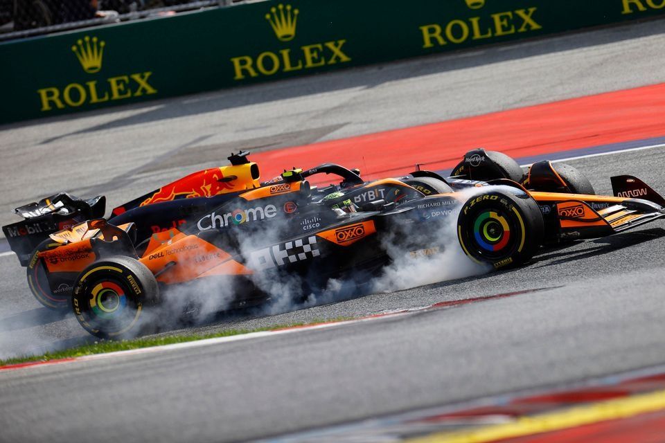 Max Verstappen, Red Bull Racing RB20, battles with Lando Norris, McLaren MCL38