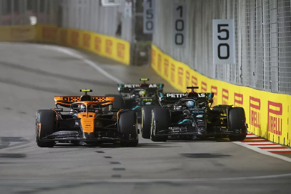 Lando Norris, McLaren MCL60, leads George Russell, Mercedes F1 W14