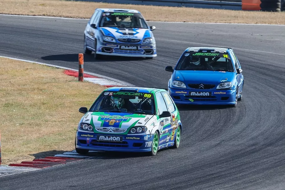 Ollie Smith (80) winning the first Junior Saloon race ahead of Martin Wright (14)