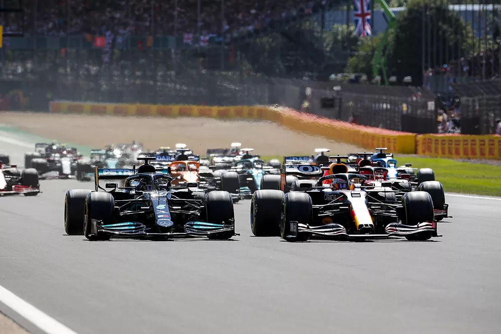 Max Verstappen, Red Bull Racing RB16B leads Lewis Hamilton, Mercedes W12 at the start of the race

