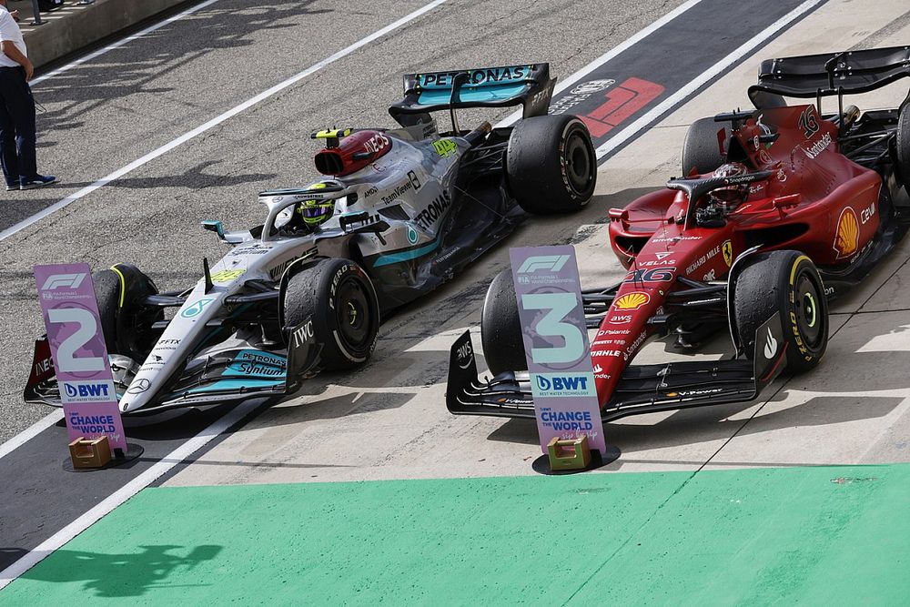 Lewis Hamilton, Mercedes W13, 2nd position, Charles Leclerc, Ferrari F1-75, 3rd position, arrive in Parc Ferme