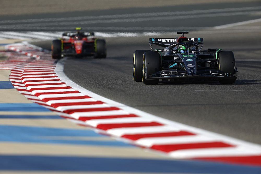 George Russell, Mercedes F1 W14, leads Carlos Sainz, Ferrari SF-23