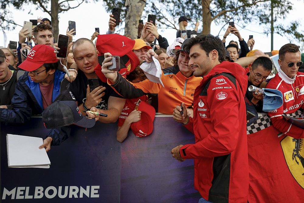 Carlos Sainz, Ferrari SF-23 interacts with fans as he arrives at the track