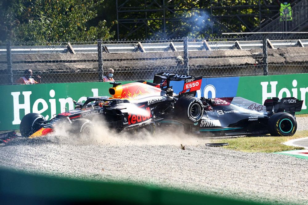 Max Verstappen, Red Bull Racing RB16B, and Lewis Hamilton, Mercedes W12, collide whilst battling for position