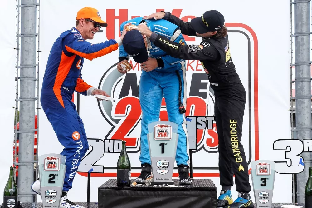 Scott McLaughlin, Team Penske Chevrolet, Scott Dixon, Chip Ganassi Racing Honda, Colton Herta, Andretti Global w/ Curb-Agajanian Honda celebrate on the podium with cream puffs
