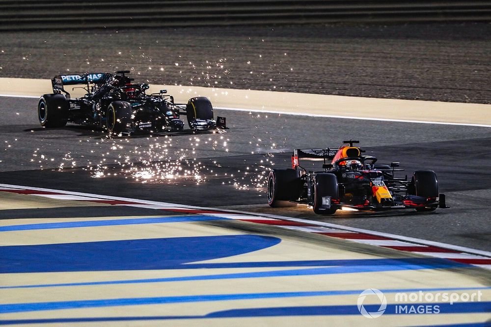 Sparks fly as Max Verstappen, Red Bull Racing RB16, George Russell, Mercedes F1 W11