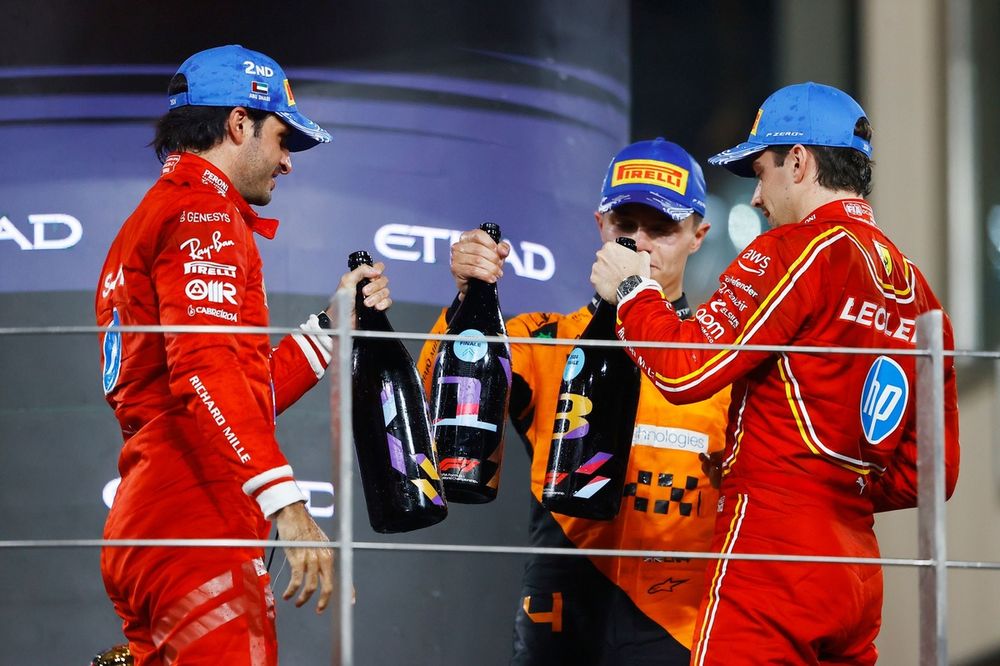 Carlos Sainz, Scuderia Ferrari, 2nd position, Lando Norris, McLaren F1 Team, 1st position, Charles Leclerc, Scuderia Ferrari, 3rd position, celebrate on the podium