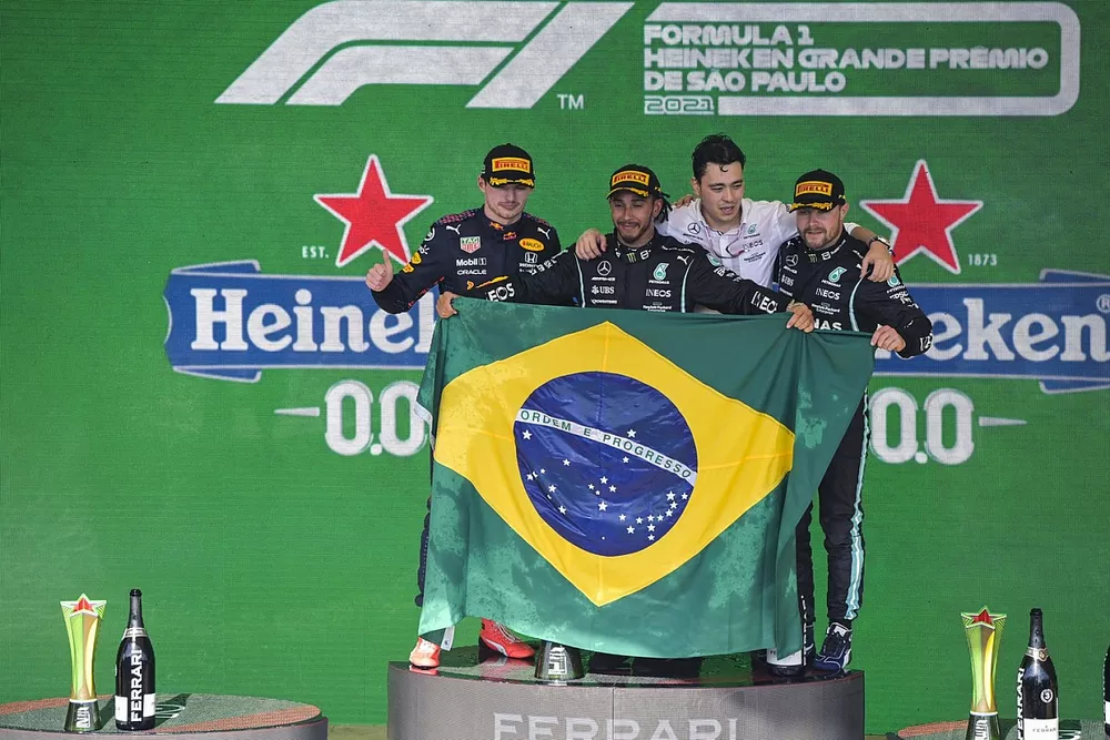 Lewis Hamilton, Mercedes, 1st position, Max Verstappen, Red Bull Racing, 2nd position, the Mercedes trophy delegate and Valtteri Bottas, Mercedes, 3rd position, on the podium
