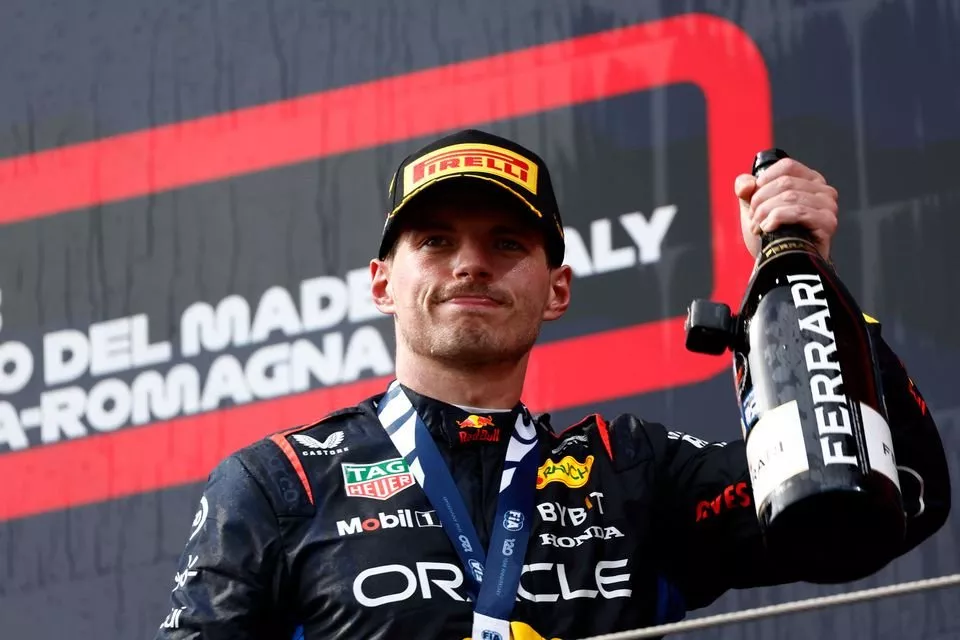 Max Verstappen, Red Bull Racing, 1st position, on the podium with Champagne